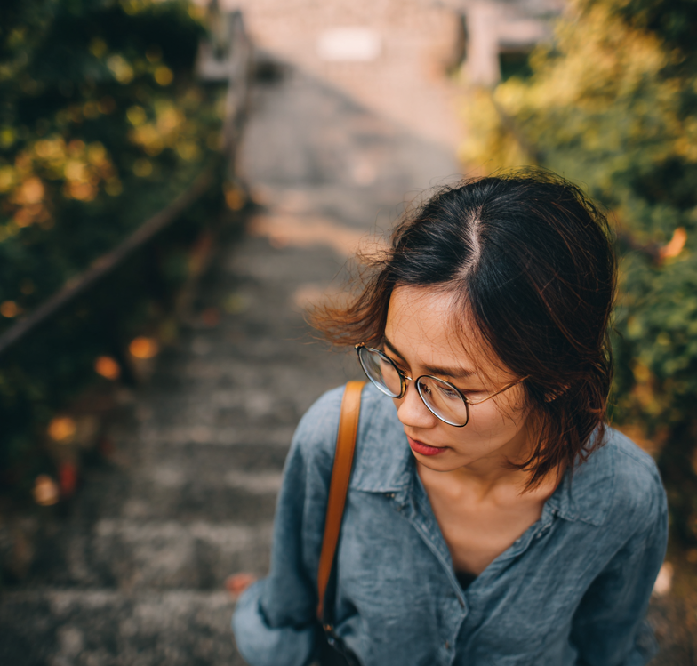 Woman walking up stairs. Image produced using Midjourney